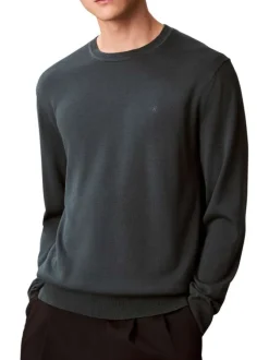 Pull en coton vert sapin uni avec une coupe droite et un col rond