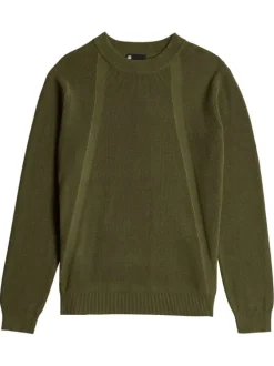 Pull en coton vert uni avec un col rond et un patch d'authenticité