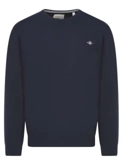 Pull en laine d'agneau marine uni avec une coupe droite et un col rond
