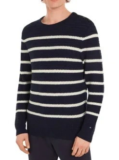 Pull en laine marine à rayures blanches avec une coupe droite et un col rond