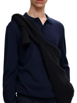 Pull en laine merinos marine uni avec une coupe droite et un col polo