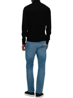 Pull en laine merinos noir uni avec une coupe droite et un col roulé
