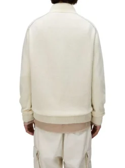 Pull en laine mélangée beige uni avec une coupe droite et un col camionneur