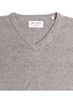 Pull gris uni avec une coupe droite à col v et nom de la marque