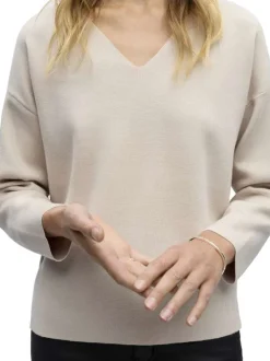 Pull gris uni coupe ample pourvu d'un col v et de manches longues