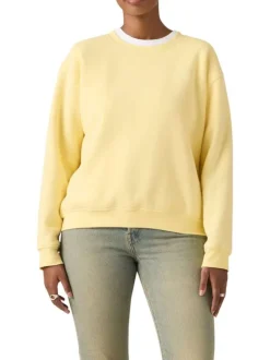 Pull jaune à coupe droite pourvu d'un col rond et de manches longues