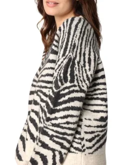 Pull noir et blanc zébré avec un col rond et des manches longues