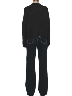 Pull noir et écru à manches longues orné d'un motif floral oversize