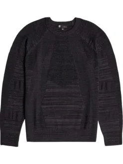Pull noir uni avec des manches longues et une coupe droite à col rond