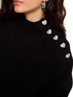 Pull noir uni pourvu d'un col montant et de manches longues