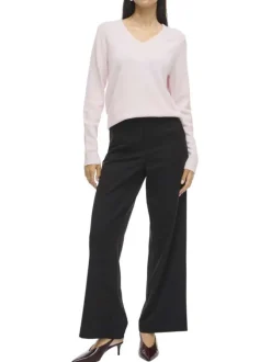 Pull rose uni avec une coupe droite et des manches longues