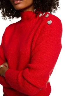 Pull rouge en maille tricotée pourvu d'un col montant et de manches longues