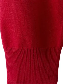 Pull rouge et blanc à rayures avec une coupe droite et un col à revers