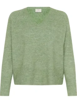 Pull vert uni avec une coupe ample avec un col v et des manches longues