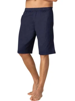 Pyjama court en coton marine à pois avec une coupe fermée et un col en V