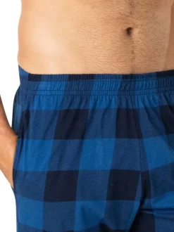 Pyjama long en coton bleu marine à carreaux avec un col chemise et une poche