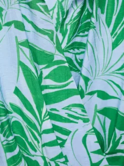Robe courte ciel imprimé feuilles avec col v à revers et coupe cache-coeur