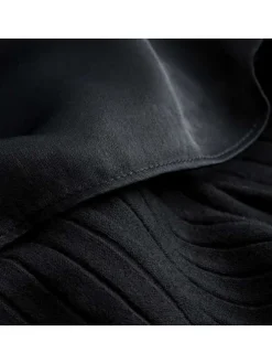 Robe courte en partie en coton stretch noir à manches longues et jupe aspect velours