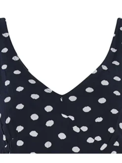 Robe courte marine à pois avec manches à bretelles réglables par un noeud