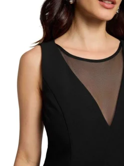 Robe courte noire unie à zip avec une coupe patineuse et col V