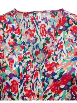 Robe courte rouge ornée d'un motif à pois et pourvu d'un col v