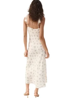 Robe longue écrue à motifs pourvue d'une coupe évasée et d'un col en v