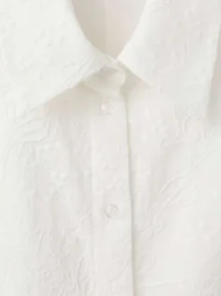 Robe longue en coton blanche unie pourvue d'une coupe évasée