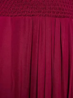 Robe midi prune uni pourvue d'une coupe asymétrique et d'un col en V
