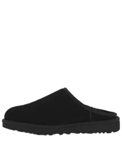 Sabots en cuir noir à talon plat et à slip-on avec de la fourrure synthétique