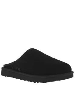 Sabots en cuir noir à talon plat et à slip-on avec de la fourrure synthétique