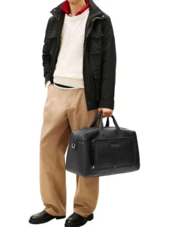 Sac weekender noir aspect grainé pourvu d'une bandoulière amovible