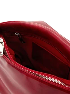 Sac bandouliere rouge uni pourvu d'une anse bicolore tressée
