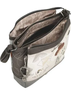 Sac à bandoulière écru imprimé avec un logo de la marque métallique à l'avant
