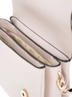 Sac bandoulière rose pâle uni avec bords noires et logo de la marque