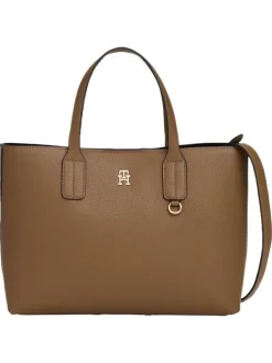 Sac à main marron pourvu d'une bandoulière amovible et d'un bouton à pression