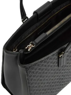 Sac à main noir pourvu d'une bandoulière amovible et de détails dorés