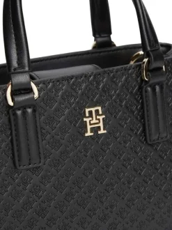 Sac à main noir pourvu d'une bandoulière amovible et de détails dorés