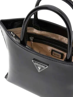 Sac à main porté épaule noir verni pourvu d'une bandoulière amovible et réglable