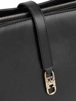 Sac noir uni avec fermeture aimantée et logo de la marque doré