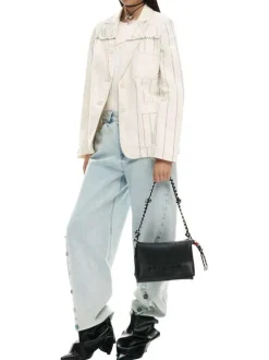 Sac noir uni pourvu d'une anse blanche et noire et d'une bandoulière