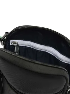 Sacoche noire unie avec logo iconique sur le devant et bandoulière ajustable