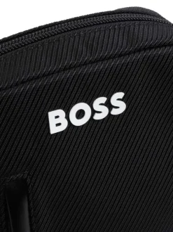 Sacoche noire unie avec un logo iconique et une bandoulière ajustable