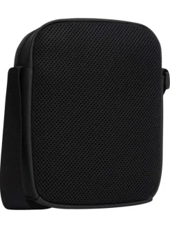 Sacoche noire unie avec une bandoulière ajustable et fermeture à zip