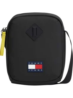 Sacoche noire unie avec une bandoulière ajustable et fermeture à zip