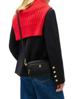 Sacoche noire pourvue d'une bandoulière amovible et du logo de la marque
