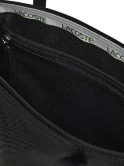 Sac shopping noir pourvu d'une fermeture zippée et du logo de la marque