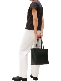 Sac shopping noir uni avec logo doré embossé et fermeture zippée