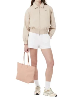 Sac shopping rose pourvu d'une fermeture zippée et du logo de la marque