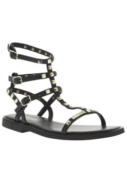 Sandales en cuir noires avec des clous dorés et à talon décroché bas
