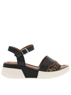 Sandales en cuir noires et blanches à détails léopard et à talon compensé